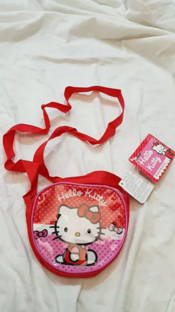 Hello Kitty - Sanrio - Bandolera Pequeña De PVC con Escrito Rojo 12x15- Nuevo