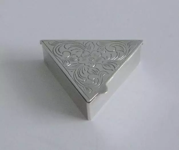 A Flower Decorated Triangular Shaped Sterling Silver Pill Box