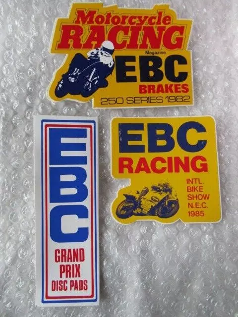 Three EBC vintage motorcycle racing stickers, one Joey Dunlop