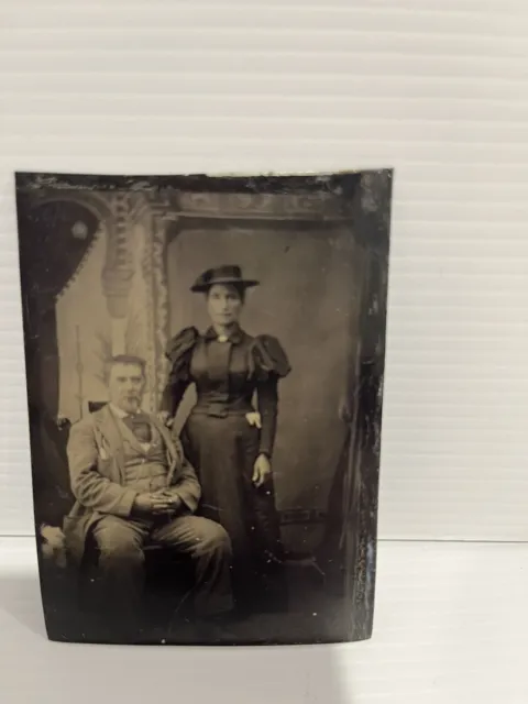 Antique Victorian  Tin Type Photo Portrait Older Man And Lady With hat