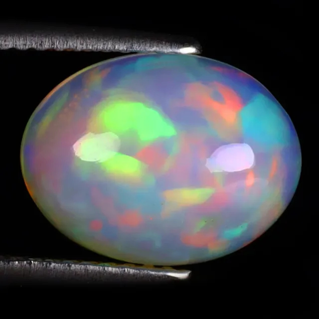 3.21 ct Oval Cabochon (13 x 10 mm) Ethiopian 360 Degree Flashing Rainbow Opal