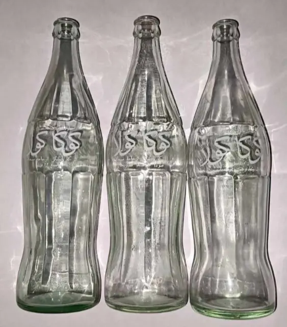 Collection of THREE vintage Coca-Cola bottles of 77 CL arabic writting old
