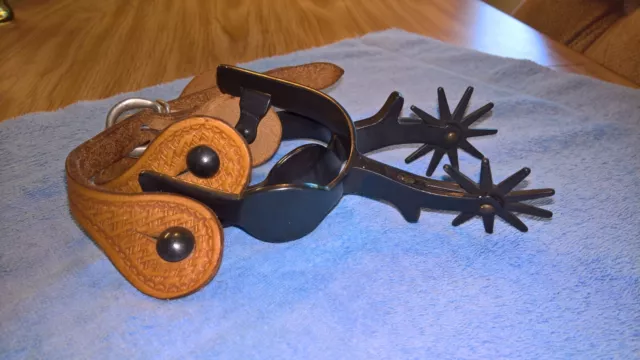 Vintage western spurs w/tooled brown leather straps, gun metal black spurs