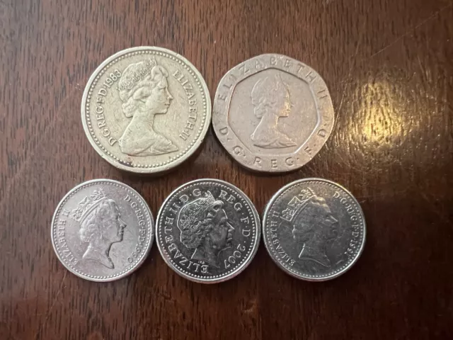 British Coins: 1 1983 Pound, 1 1982 Twenty Pence, 3 Five Pence