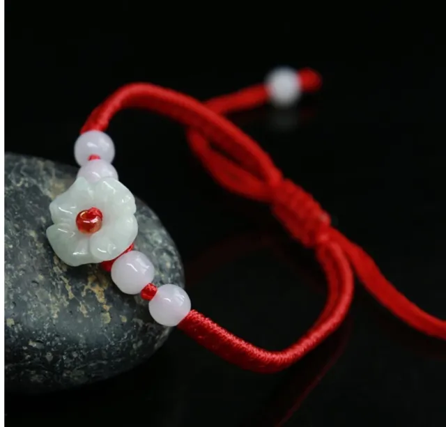 Adjustable Jade flower bracelet with red cord