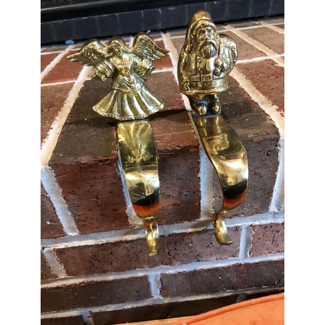 Stunning pair of Vintage gold brass “Angel and Santa” stockings hangers 8 inches