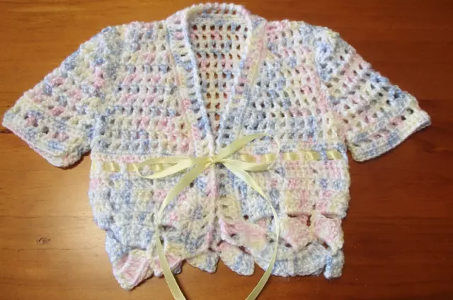 Handmade Crochet Baby short sleeved jacket made in  Baby 4 ply yarn