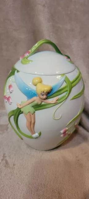 Disney's Tinkerbell 2D Oval White Cookie Jar w Figural design & Vines with box Disney's Tinkerbell 2D Oval White Cookie Jar w Figural design & Vines with box