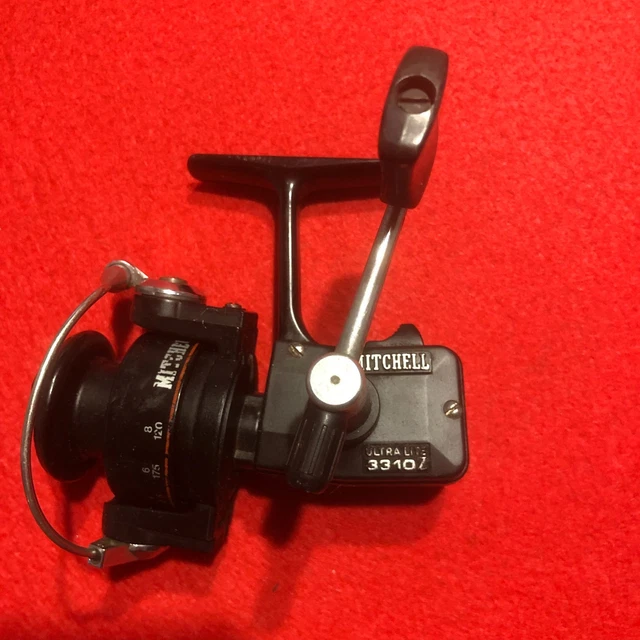 moulinet de pêche ancien de marque Mitchell 314 avec sa