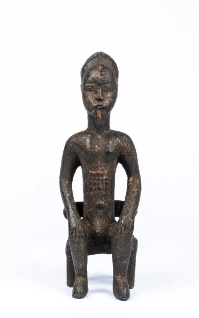 A Baule Style Seated Figurine, West Africa