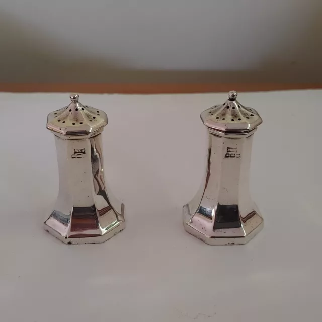 A pair of sterling silver salt and pepper shaker Sheffield