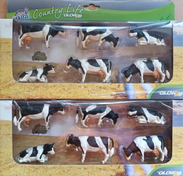 Kids Globe Kühe schwarz - weiß Kuh 12 Stück liegend - stehend - fressend