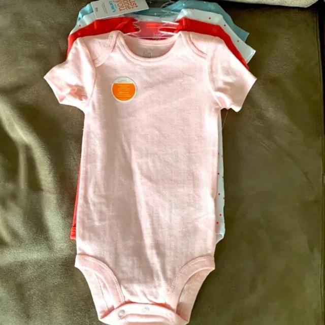 NWT FOUR piece baby girl bodysuit. CARTER’S Size 9 months.
