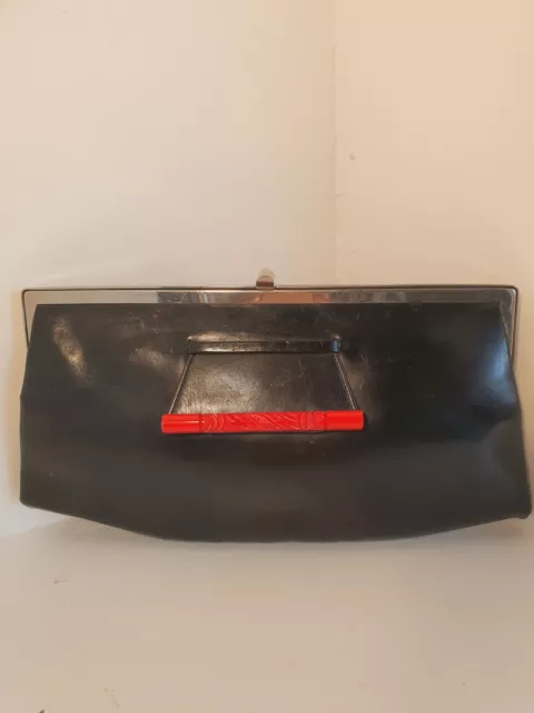 Vintage art deco 1930s  black leather clutch bag with a carved Bakelite pull