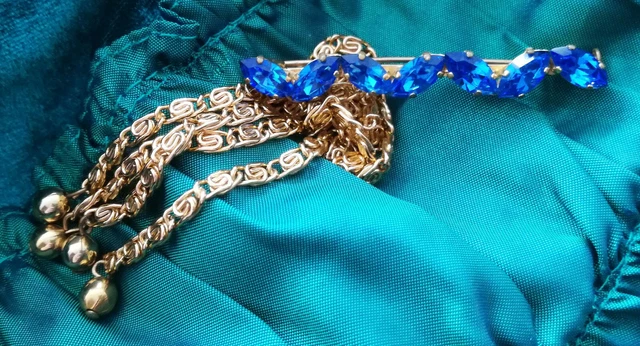 Broche en verre topaze doré roulé - France
