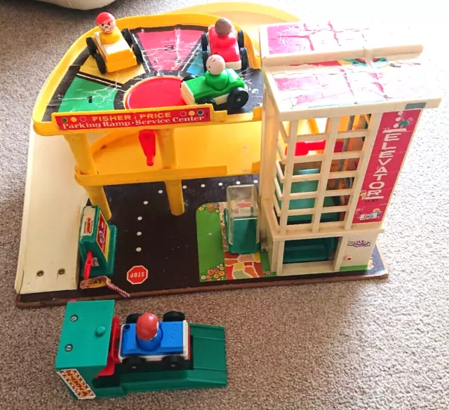 1970s Fisher Price garage complete with ramp, cars and pump good working order.