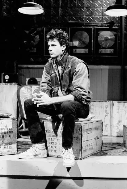 Rick Springfield as he sits on a crate during an interview on MTV a - Old Photo