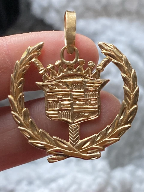 Gold cadillac pendant hot sale