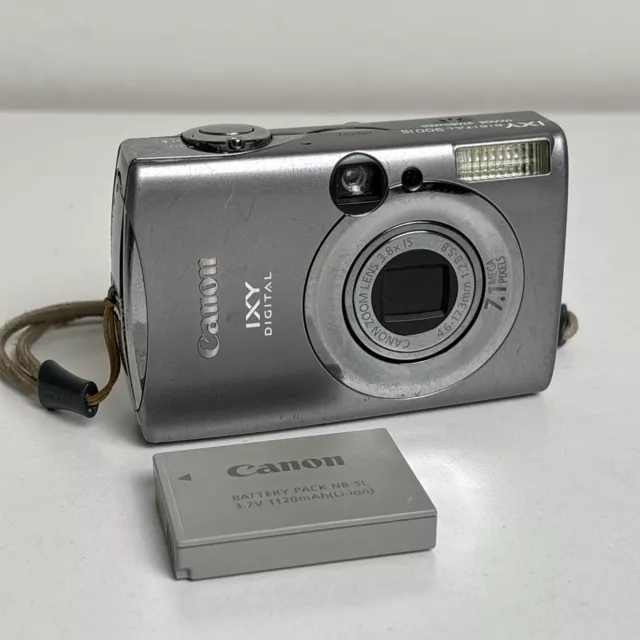 Canon IXY Digital 900 IS Silver 7.1 MP Digital Camera With Battery