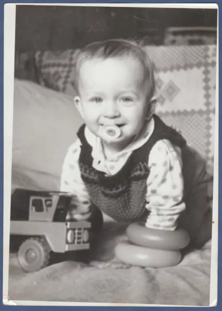 Beautiful baby playing with toys on the bed Soviet Vintage Photo USSR