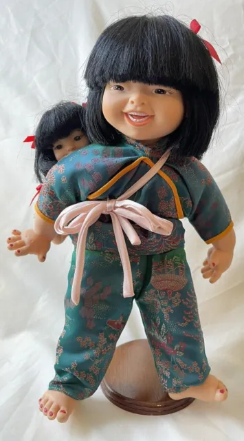 Chinese Doll  Mother Carrying a Child on her back Standing.