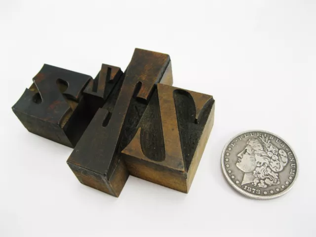 4 vintage mixed font letterpress wood type Z's. Nice old letters.