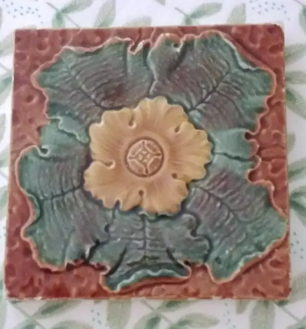 An Antique Art Nouveau Minton Hollins & Co Tile Raised Relief Brown Green  4.25"