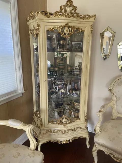 Tall vintage woodwn cabinet with wood/glass door and mirror and glass interio