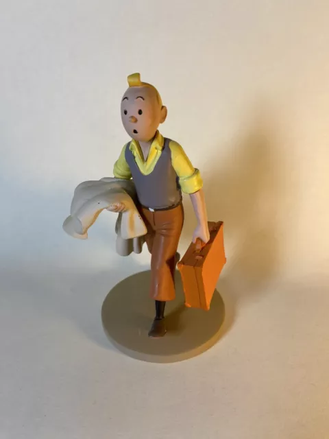 Figurine Moulinsart Tintin - Tintin en route (valise) Amérique (12 cm)
