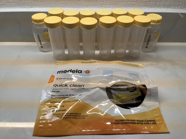 14 Medela bottles 2.7 or 5 oz milk storage bottles with lids
