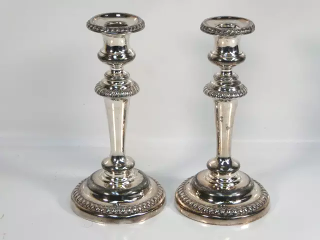 A pair of antique old sheffield plate candlesticks. Unidentified makers mark