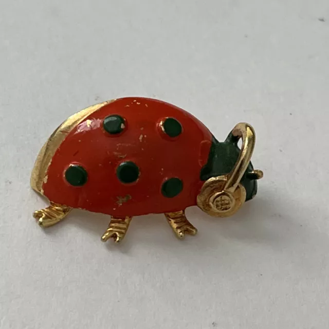 Ladybug Red Beetle Green Spots wearing earmuffs/headphones Pin