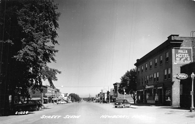 RPPC NEWBERRY MICHIGAN STREET SCENE FALLS HOTEL CARS REAL PHOTO POSTCARD (1940s)