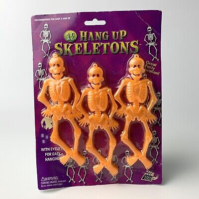 Esqueletos colgantes vintage que brillan en la oscuridad 12 unidades naranja