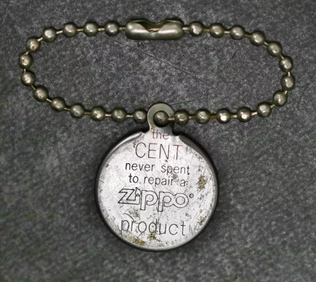Zippo Encased Cent Tag " The Cent Never Spent To Repair A Zippo " 1974 Penny