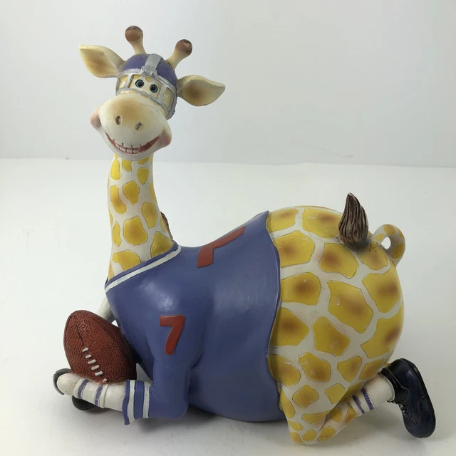 Giraffe piggy bank. Whimsical figurine Spring head dressed in football gear Ball