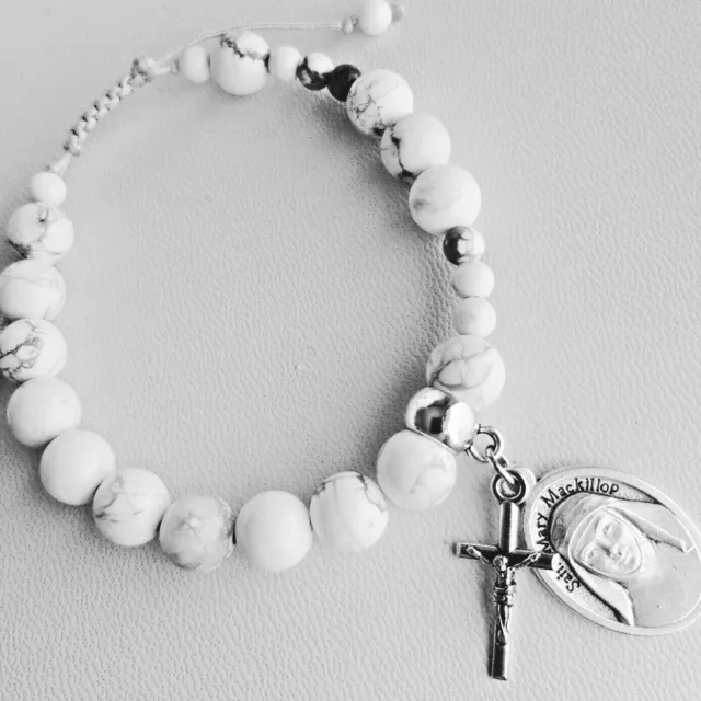 White howlite Rosary bracelet with choice of Catholic saint and crucifix.
