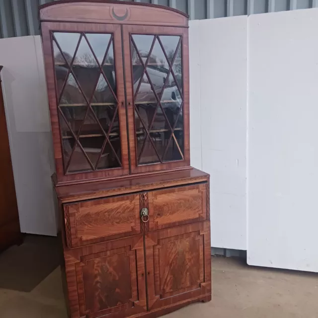 A Regency mahogany and ebony inlaid secretaire bookcase