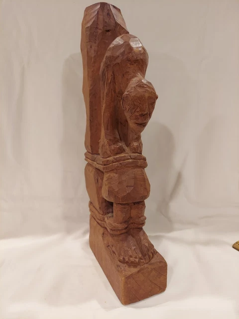 Handcarved Figure Tied To Post