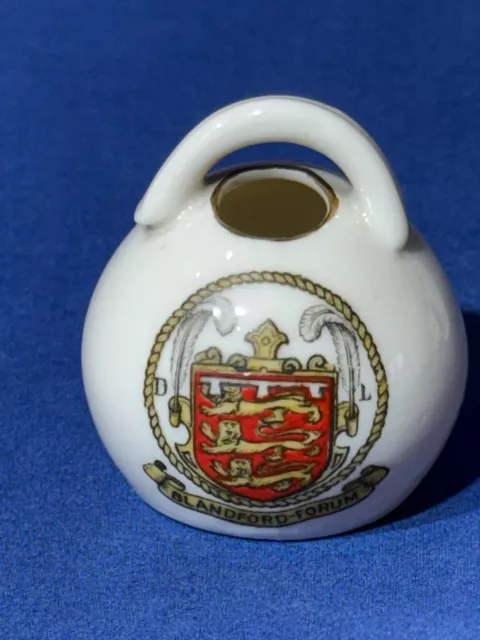 Goss crested China - model of old salt pot showing Blandford Forum crest