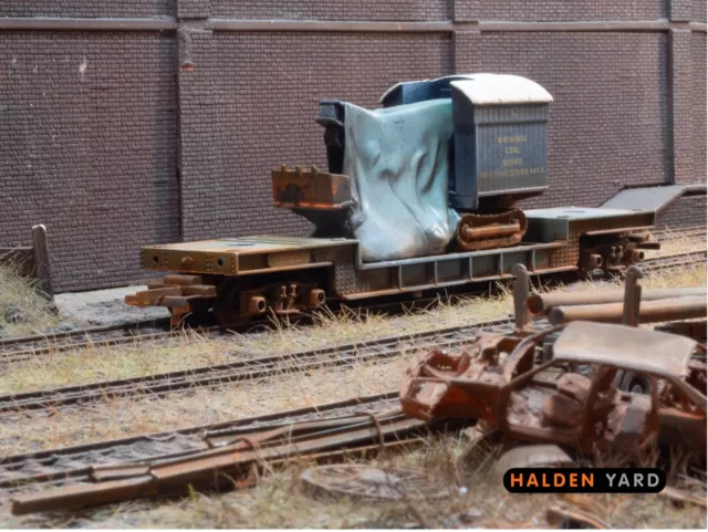 OO gauge wagon, abandoned scrapyard Lowmac with excavator load.