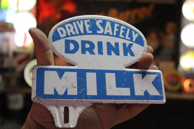 RARE 1950s DRIVE SAFELY DRINK MILK STAMPED PAINTED METAL LICENSE TOPPER SIGN