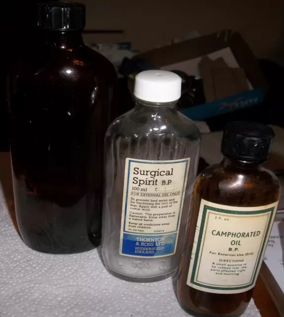 old glass medicine bottles. 2 brown 1 clear glass All are ribbed at back.