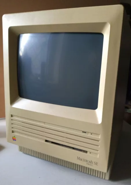 Macintosh SE FDHD with keyboard, mouse and several manuals.