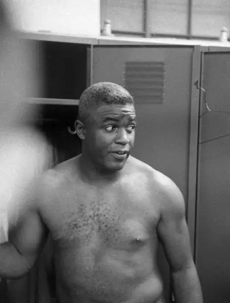 Brooklyn Dodgers Jackie Robinson in locker room after game vs Milw - Old Photo 1