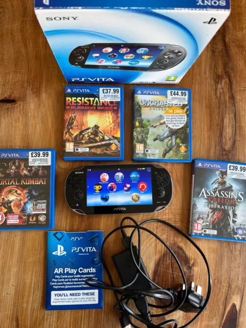 SONY PS VITA Console with box charger memory 4 games