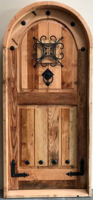 Rustic reclaimed lumber arched top storybook winery DOOR speakeasy wrought iron