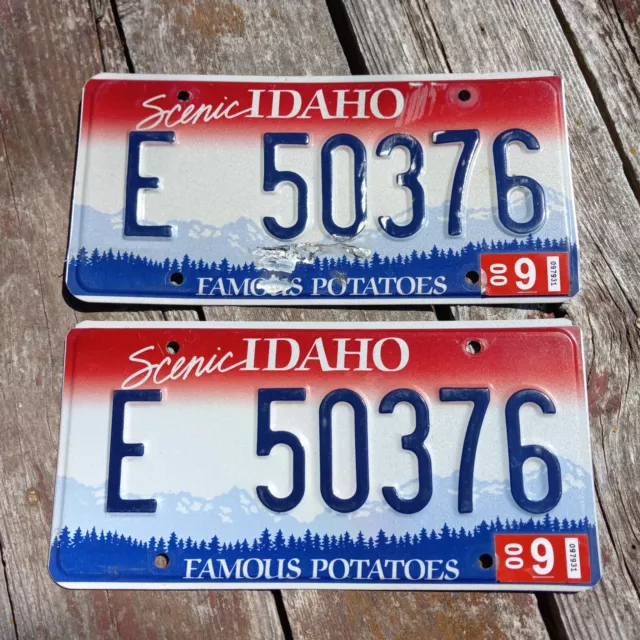 PAIR 2000 Idaho License Plates - "E 50376" 9 00 sticker FAMOUS POTATOES SCENIC I