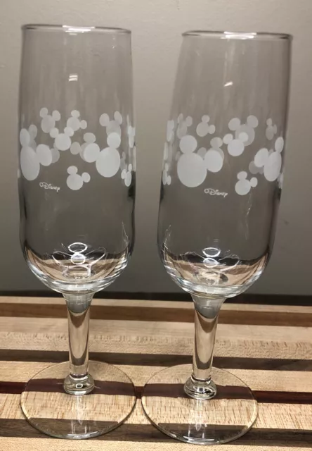 https://www.picclickimg.com/RiwAAOSwzDFkiMCG/Disney-Glass-Champagne-Flutes-Etched-Mickey-Mouse-Ears.webp