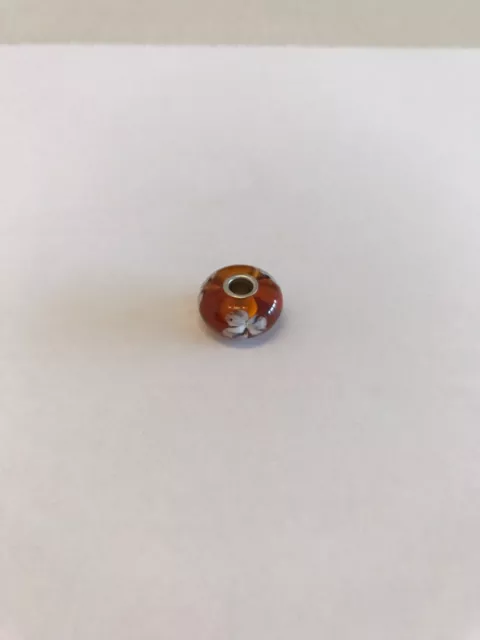 Original TROLLBEADS Bead, Murano Glas Braun mit  Blume, Silberkern. Neu.